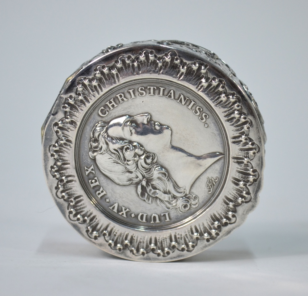 A French circular white metal snuff box, the hinged cover inset with a 1745 Louis XV medallion, - Image 2 of 3