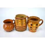 Three antique slip decorated jugs,