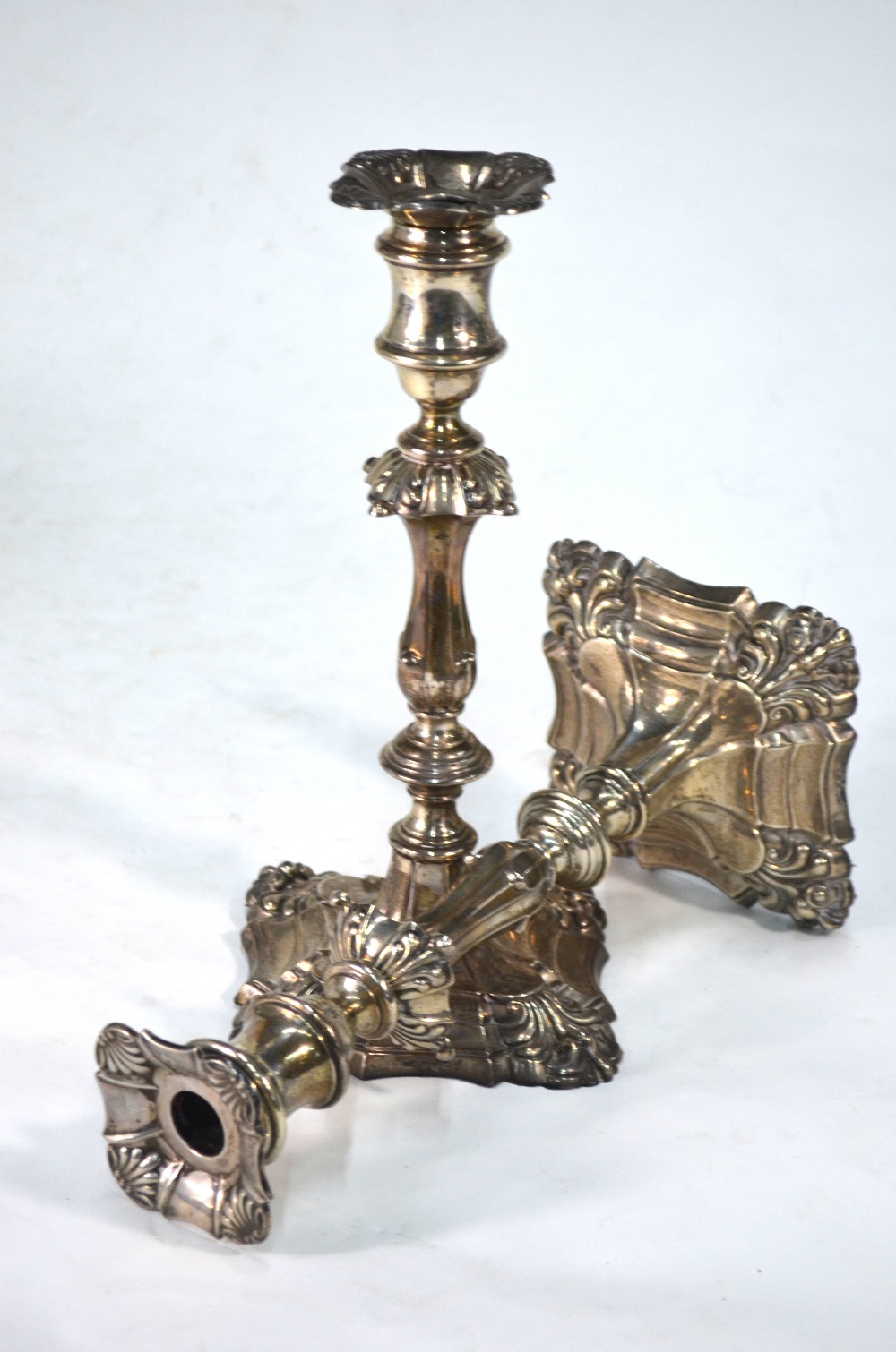 An Edwardian pair of loaded silver baluster candlesticks in the Georgian manner,