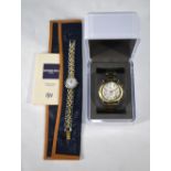 A Raymond Weil lady's stainless steel and gilt wristwatch with wallet and 1997 guarantee,