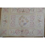 An Aubusson style needlepoint rug, the ochre ground with floral design,