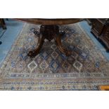 An Indo-Persian small carpet, the repeating design of geometric diamond lozenges on blue ground,