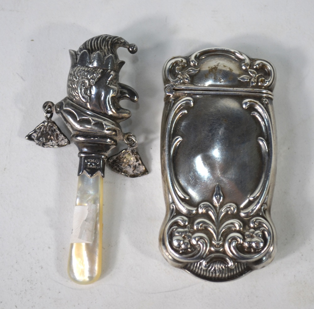 A 'Mr. Punch' silver baby's rattle with mother-of-pearl handle, W H Collins & Co.