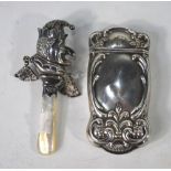 A 'Mr. Punch' silver baby's rattle with mother-of-pearl handle, W H Collins & Co.