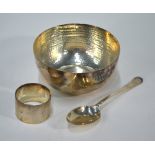 A planished silver Christening bowl, spoon and napkin ring, Atkin Brothers, Sheffield 1915, 9.