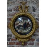 A 19th century giltwood and composite convex mirror, surmounted by a lyre,