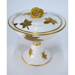 A Victorian Royal Worcester stemmed sauce tureen and cover decorated with raised gilded leaves,