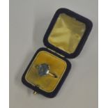 A 9ct yellow gold ring set oval blue stone, double claw setting,