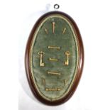 A collection of eleven gilt metal decorative watch-keys - various designs - mounted on a velvet