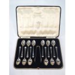A cased set of twelve silver teaspoons and tongs in the Art Deco manner, Lee & Wigfull,