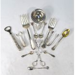 Two US Sterling pastry serving forks, a pair of concertina sugar nips, two pairs of sugar tongs,