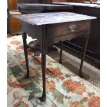 An early 18th century oak side table, the edge top over a frieze drawer,