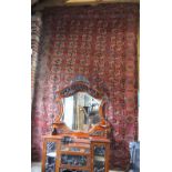 An antique red ground Turkoman carpet, the field with five rows of repeating guls,