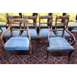 A set of four Regency rope-back mahogany side chairs with upholstered slip seats,