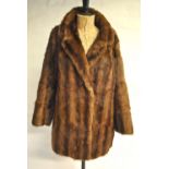 A Hickley's shadowed musquash fur coat and a dark brown French squirrel fur coat,