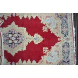 A fine Persian Kirman rug,