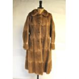 A 1970s pale musquash fur coat with original receipt, 46 cm across chest,