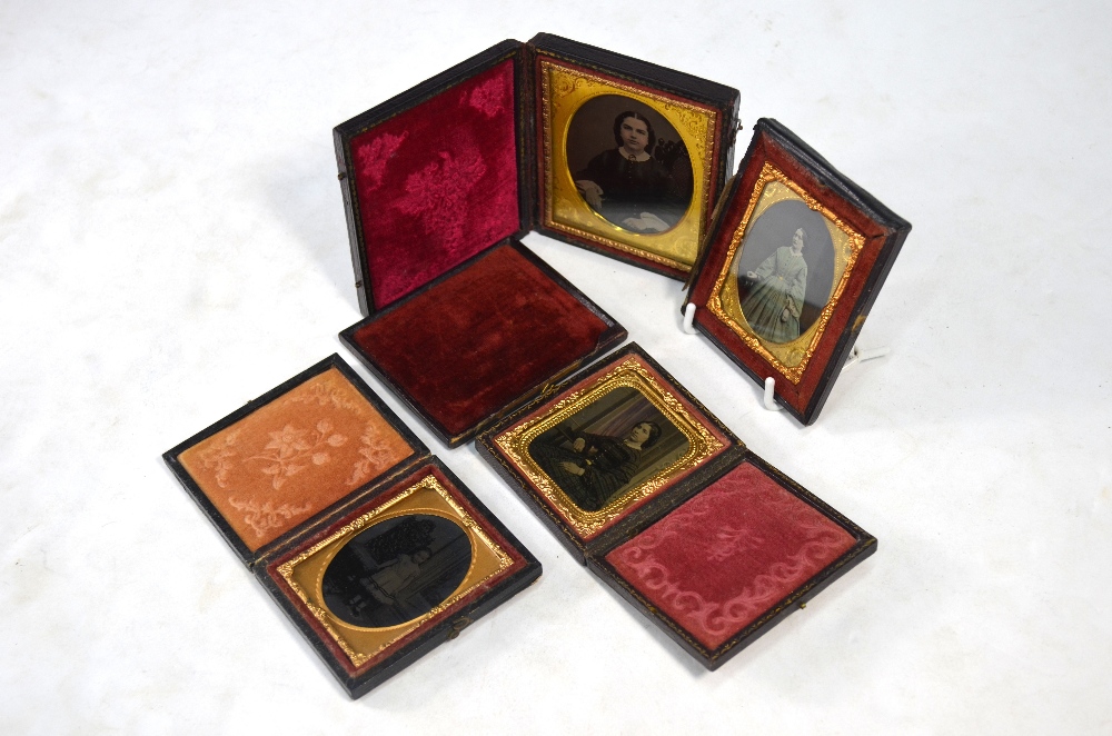 Four Ambrotypes, all cased; three of women,