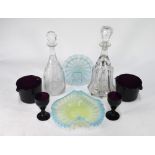 A pair of early 19th century amethyst glass twin lipped wine coolers, 8.
