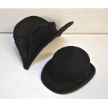 A 19th century black grosgrain silk naval bicorn hat lined with silk satin with braiding to one