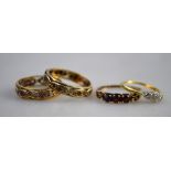 Collection of four stone set rings including white and red synthetic eternity ring,