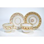 A Derby porcelain tea bowl and saucer, iron red and gilt decoration,
