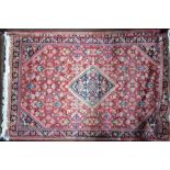 An old Persian Mahal rug, red ground,