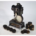 A French Pathe-Baby hand-cranked film projector, to/w a collection of film reels,