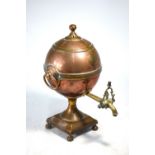 A mid 19th century copper and brass ball samovar on ball feet,