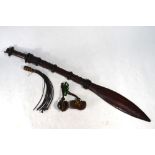 An Indian sword with curved and 76 cm fullered blade, wooden hilt with copper and brass mounts,