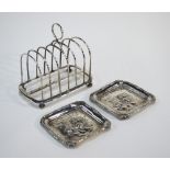 A Victorian six-division silver toast rack with ring handle and bun feet, Holland, Son and Slater,