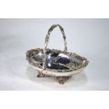 A good quality silver plated fruit basket with vine-cast rim and swing handle,