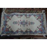 A Persian Kirman small rug, cream ground, 130 x 60 cm Condition Report good original,