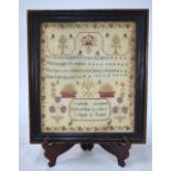 A George III crossstitched sampler worked with flora and fauna and verse within a floral border,