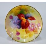 A Royal Worcester small dish painted with fruit by Kitty Blake, 10 cm dia., c.
