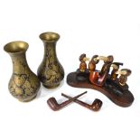 A novelty pipe-rack, modelled as birds with nut bodies and antler beaks,