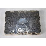An Edwardian foliate-engraved silver pocket-case of cartouche form,