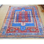An old Caucasian rug, blue ground,
