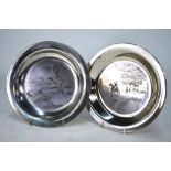Two silver dishes, niello-decorated with ducks rising and hunting scene, John Pinches,