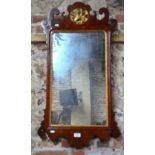 A Victorian mahogany fret cut wall mirror with parcel gilt detail,