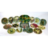 A collection of fourteen 19th century continental majolica plates, mainly French,