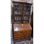 An 18th century feather-banded oak bureau bookcase,