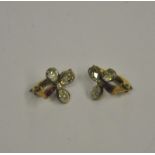 A pair of diamond and ruby trefoil ear clips,