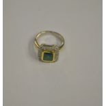 An emerald and diamond set rectangular cluster ring,