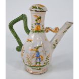 A French, or other Continental, antique Faience ewer with domed cover, decorated in blue,