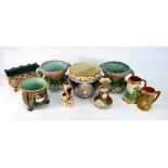 A collection of continental majolica including a pair of twin handle vases, a rectangular planter,