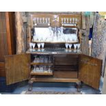 An Art Deco period walnut cocktail cabinet,