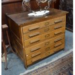 An old oak two part plan chest with six long drawers,