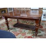 A mid Victorian mahogany extending dining table with two insert leaves,