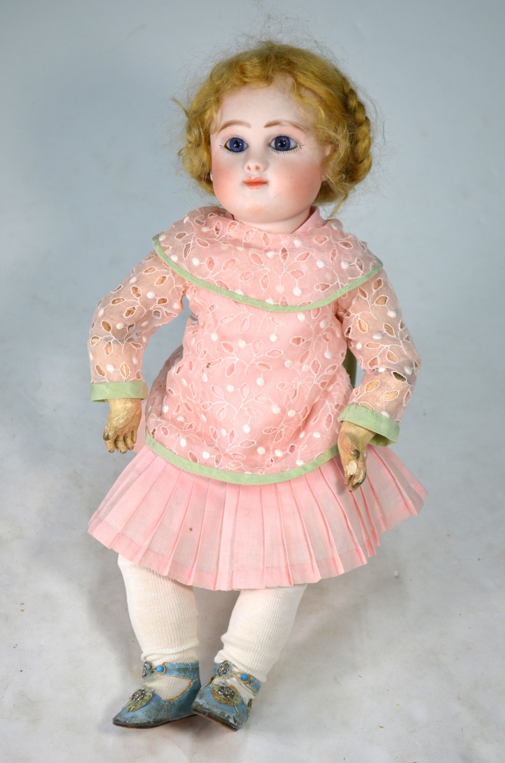 A Jules Steiner bisque-headed girl doll with plaited blond wig,